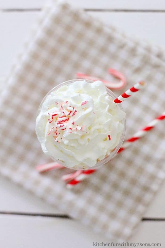 The copycat peppermint shake on a tan and checkered cloth.