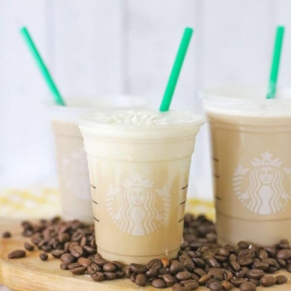 Three of the mocha drinks with green straws.