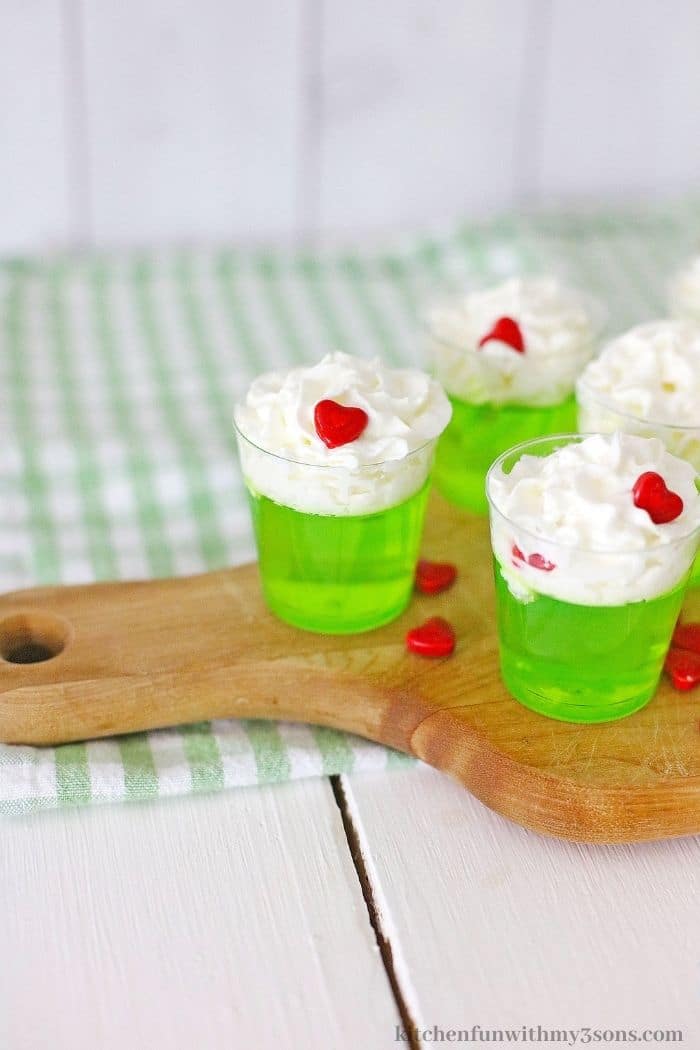 The jello shots topped with whipped cream.