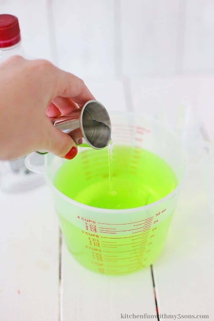 Pouring the alcohol into the jello.