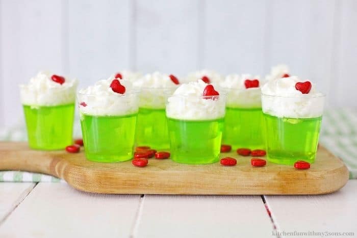 The jello shots on a white wooden table.