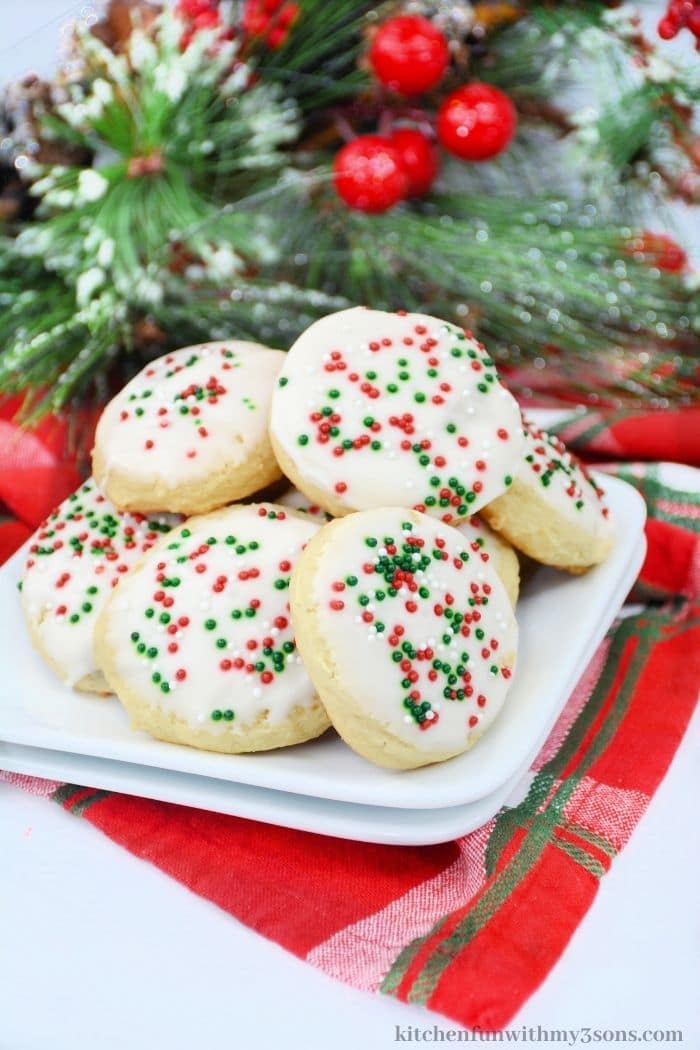 The ricotta cookies on a white serving plate.