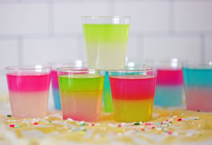 Tie-Dye Jello Shots stacked in a triangle.