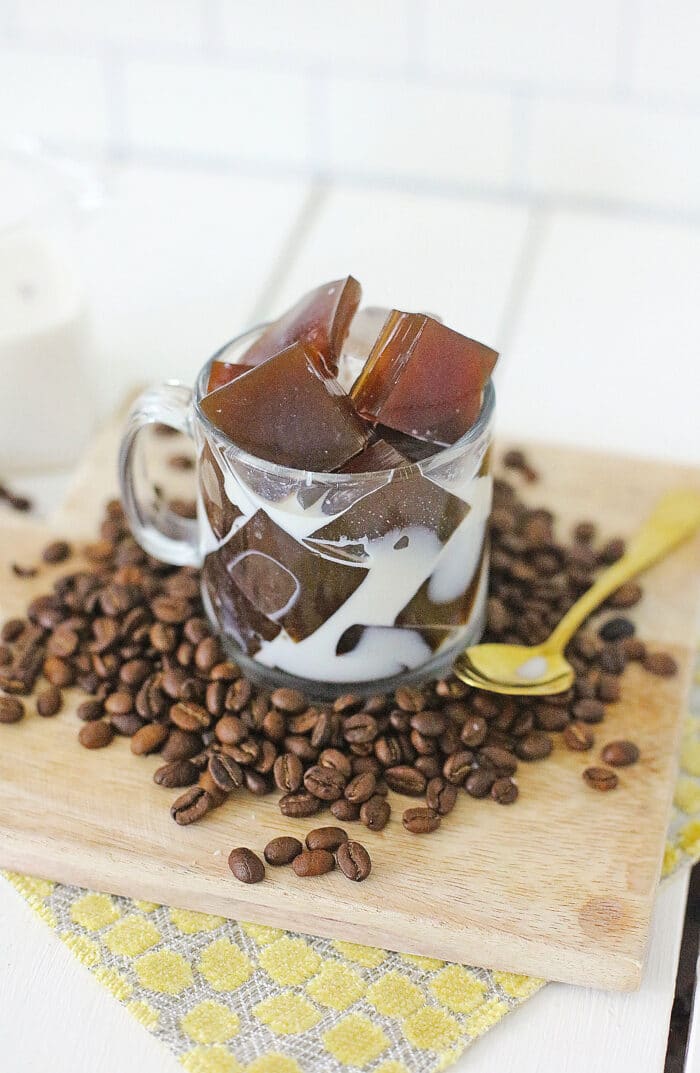 Coffee Jelly Recipe surrounded by coffee beans.
