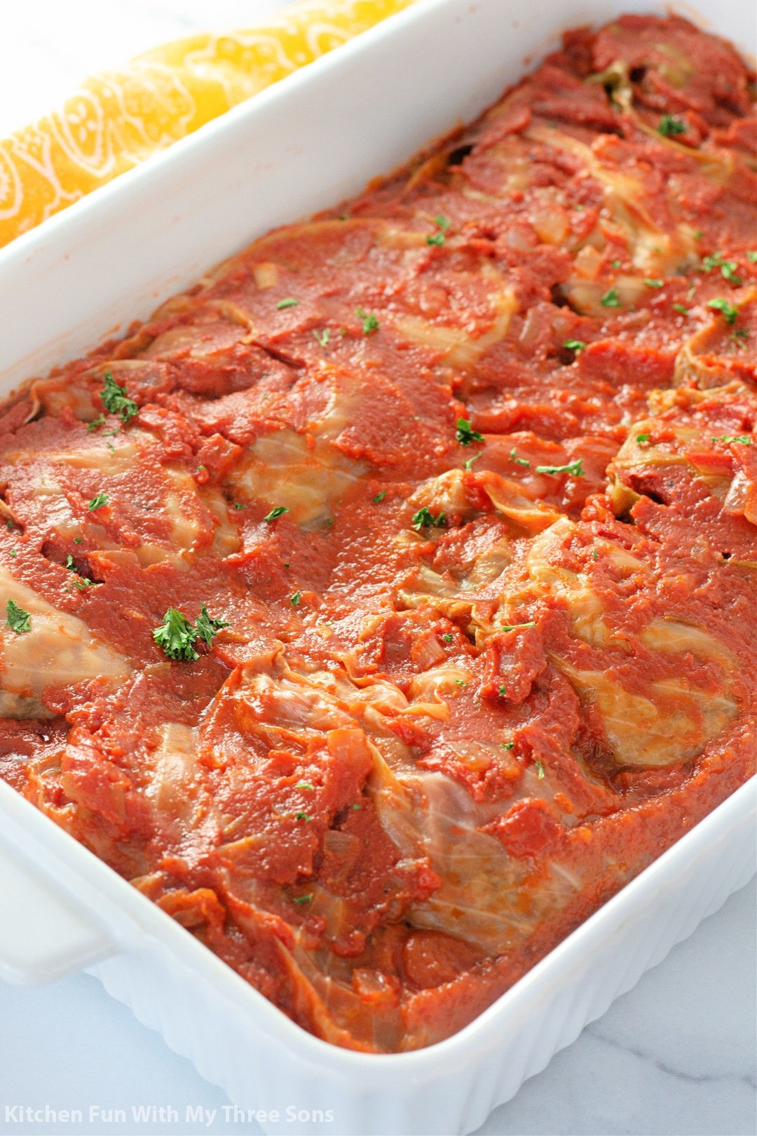 Overhead view of cabbage rolls in a baking dish