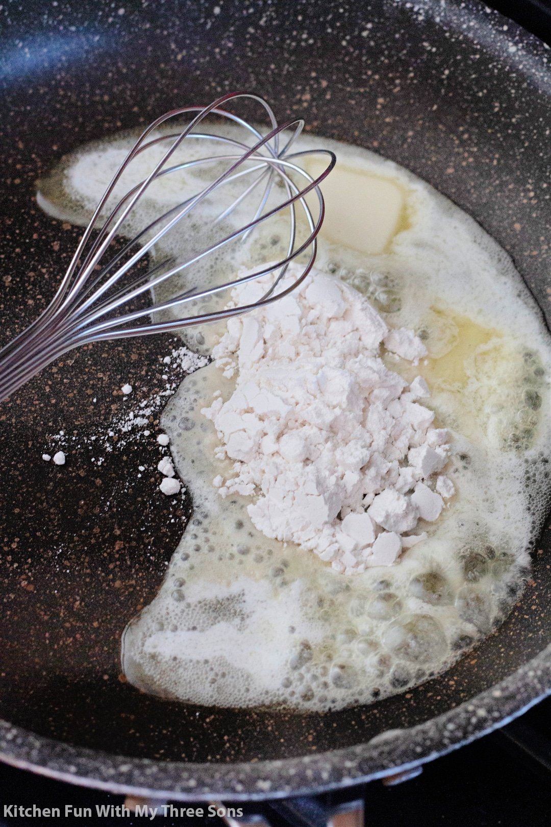 melting butter in a skillet and adding the flour.