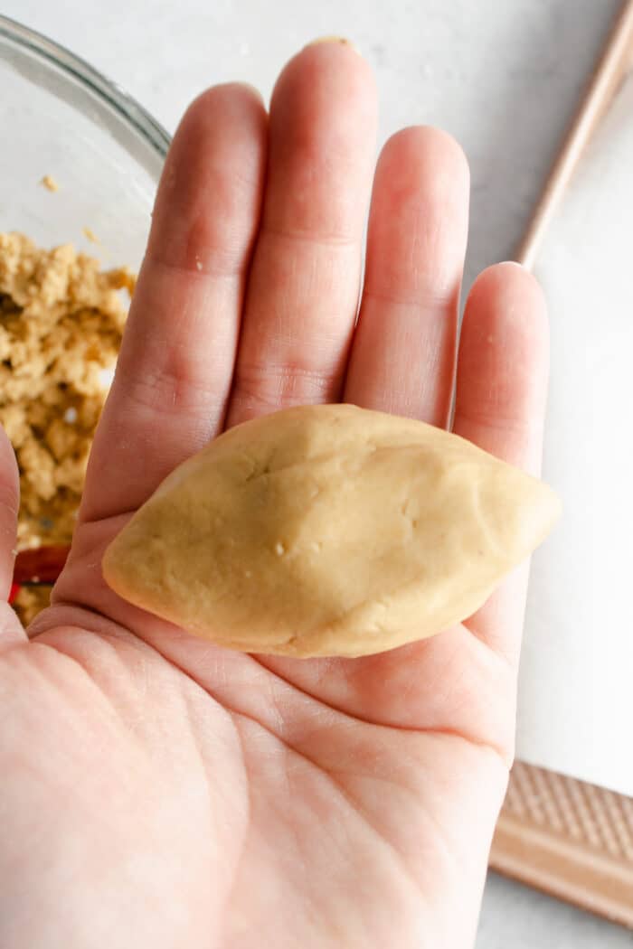 peanut butter football shape in a hand