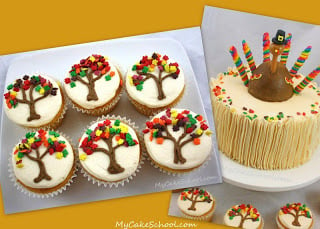 A batch of cupcakes with colorful fall tree frosting decorations beside a Thanksgiving turkey cake