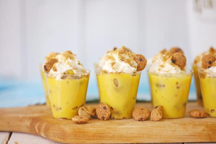 Chocolate Chip Cookie Pudding Shots on a wooden board.