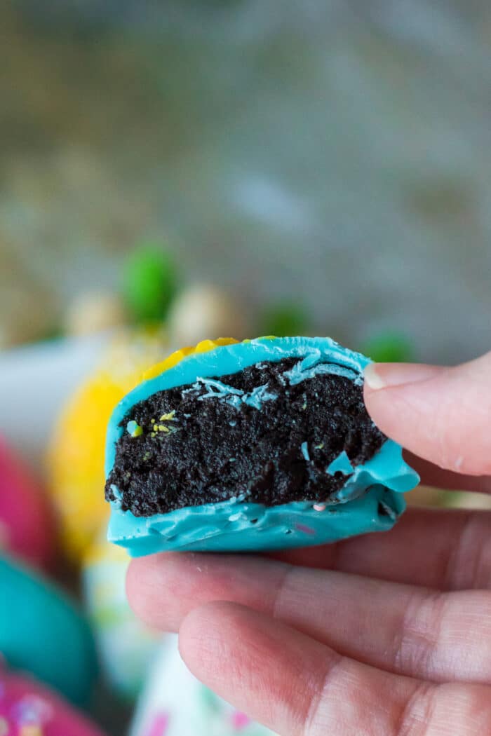One of the Easter Oreo Balls with a bite taken out.