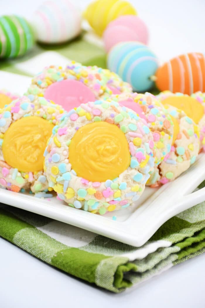 The Easter Thumbprint cookies on a white serving plate.