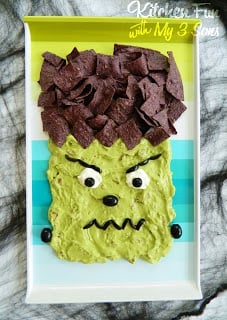 A homemade guacamole dip decorated to look like Frankenstein's head