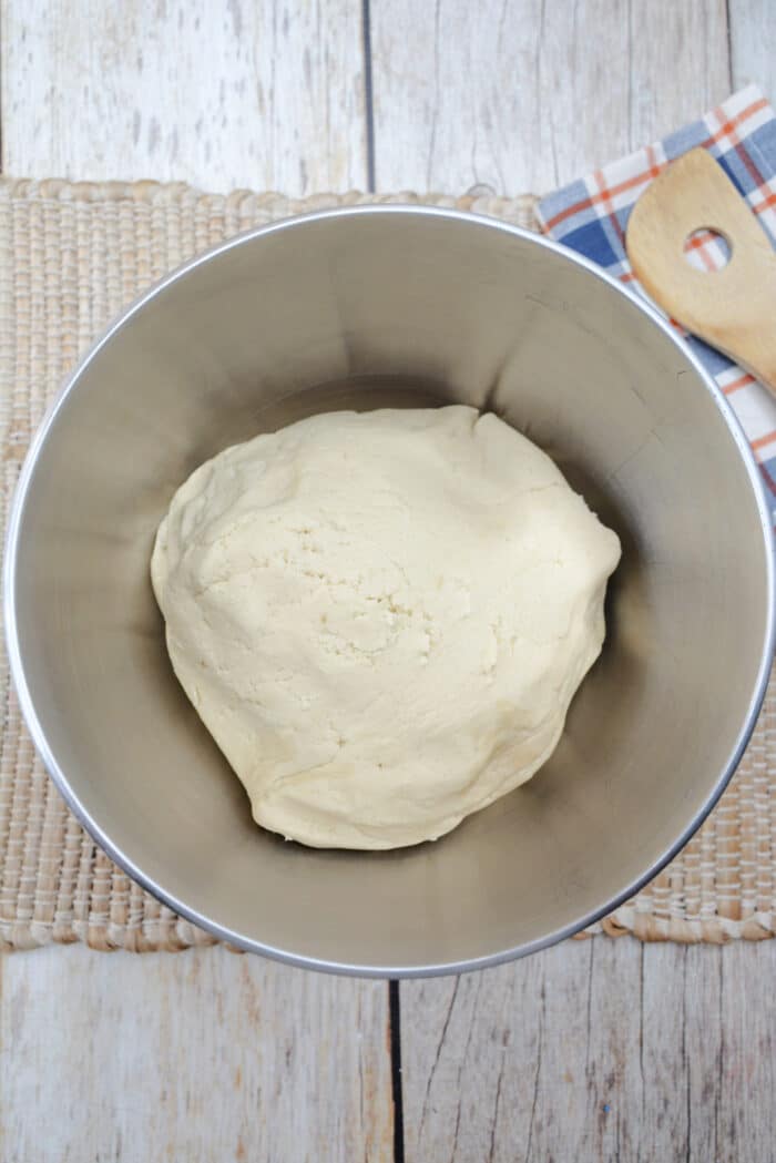The dough in a mixing bowl.