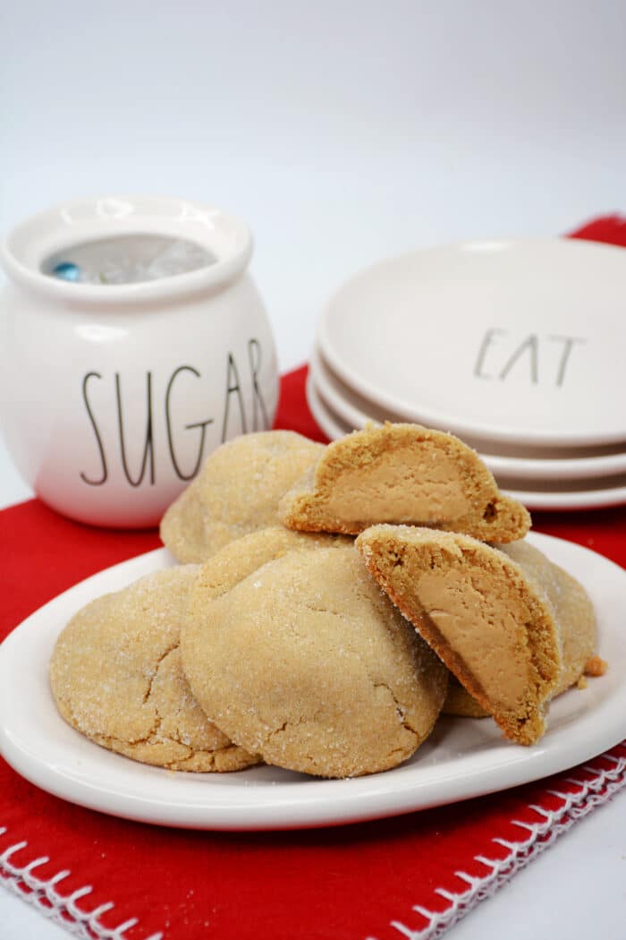 The Peanut Butter Stuffed Cookies on a red table cloth.