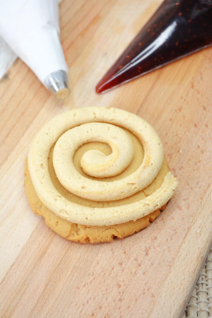 Swirling the peanut butter frosting.