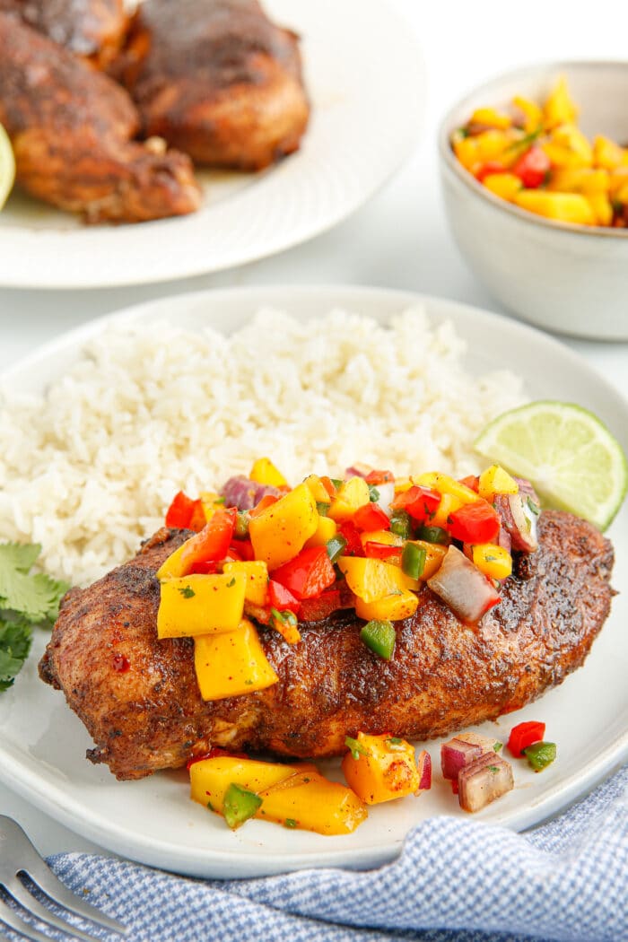The Air Fryer Jerk Chicken topped with mango salsa.
