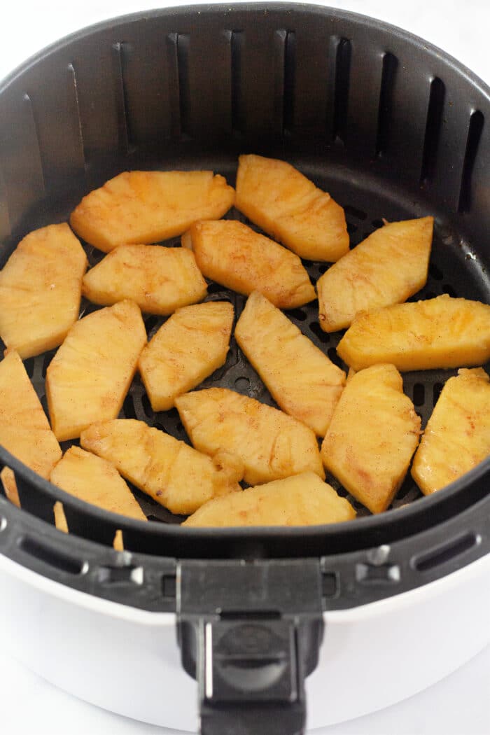 pineapple slices in an air fryer.
