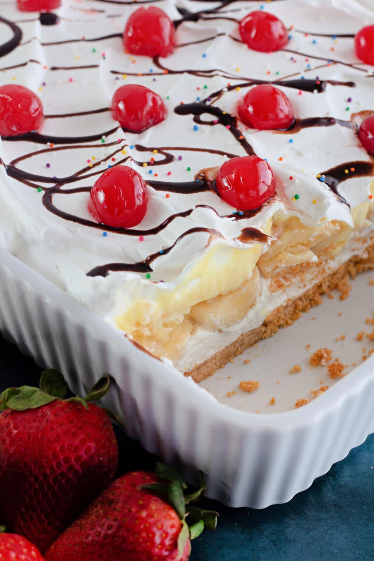 Banana Split Cake in a pan with the layers visible.
