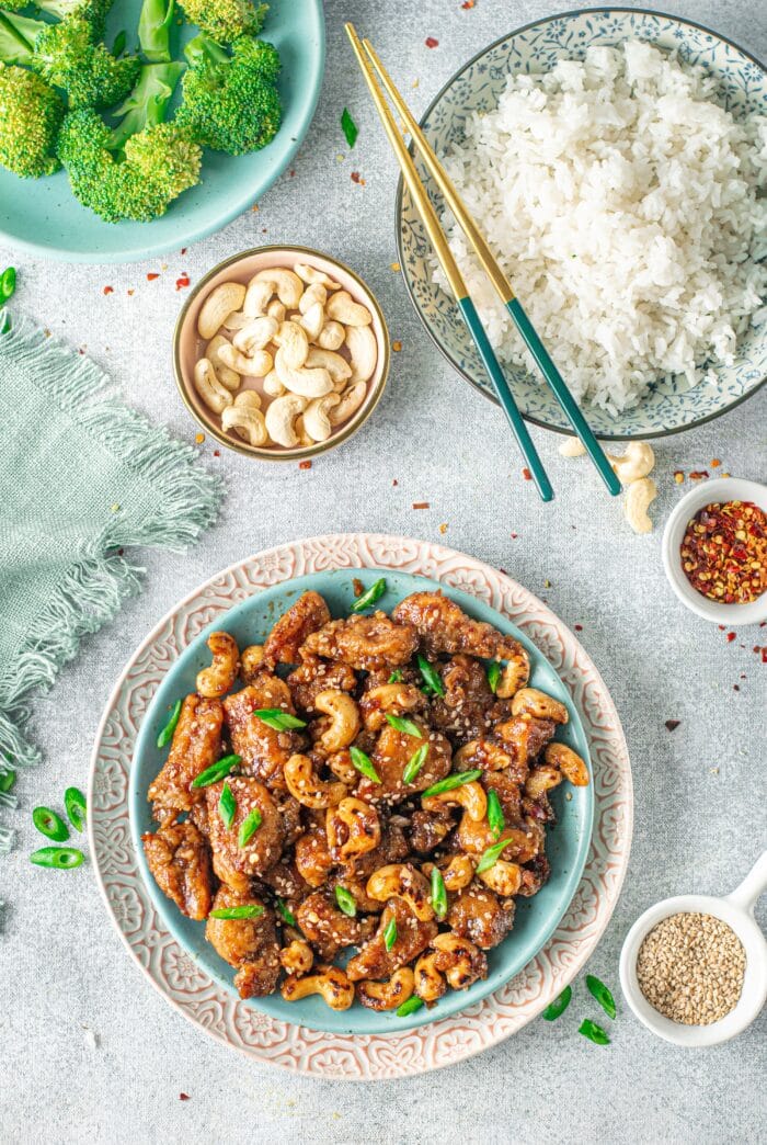 The Cashew Chicken on a light blue table.