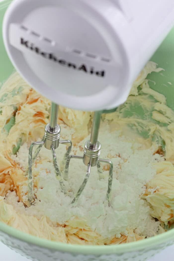 whipping cream cheese, vanilla, and powdered sugar with an electric mixer.