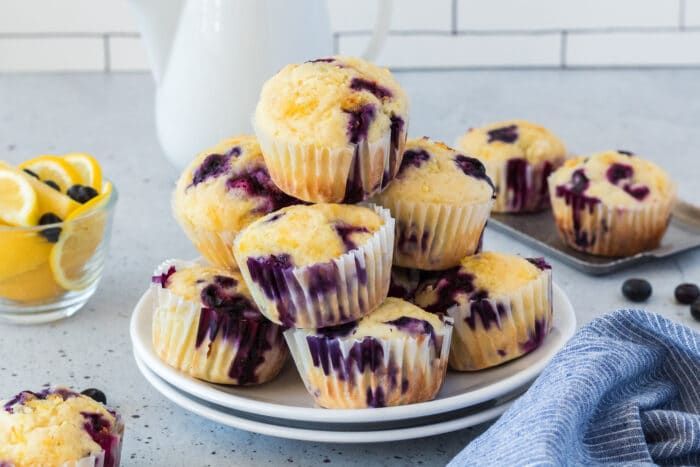 A pile of the Lemon Blueberry Muffins on a plate.