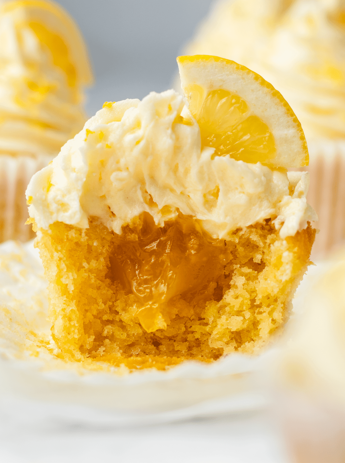 Lemon curd cupcake cut in half to see the filling