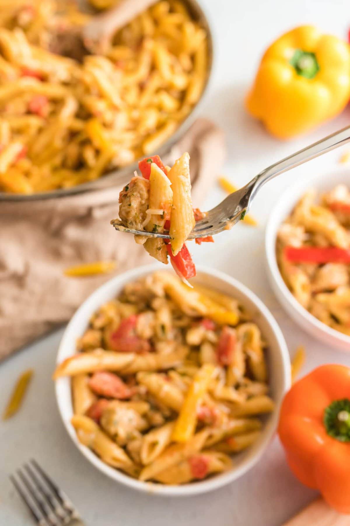 A fork lifting up some of the Cajun Chicken Pasta.