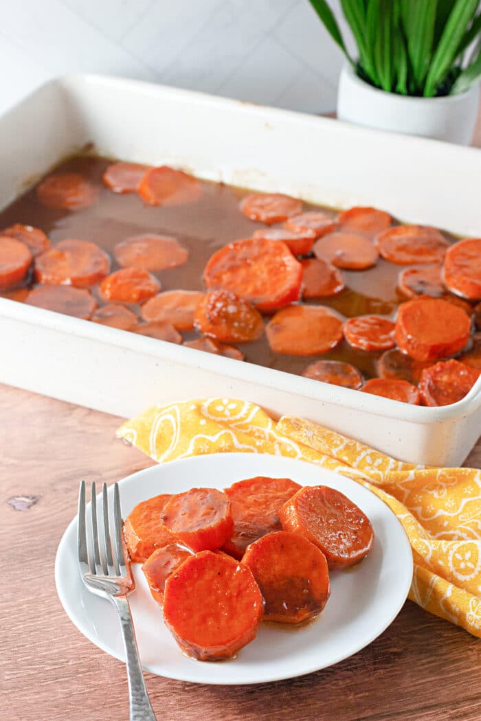 Candied Sweet Potatoes in a white baking dish.