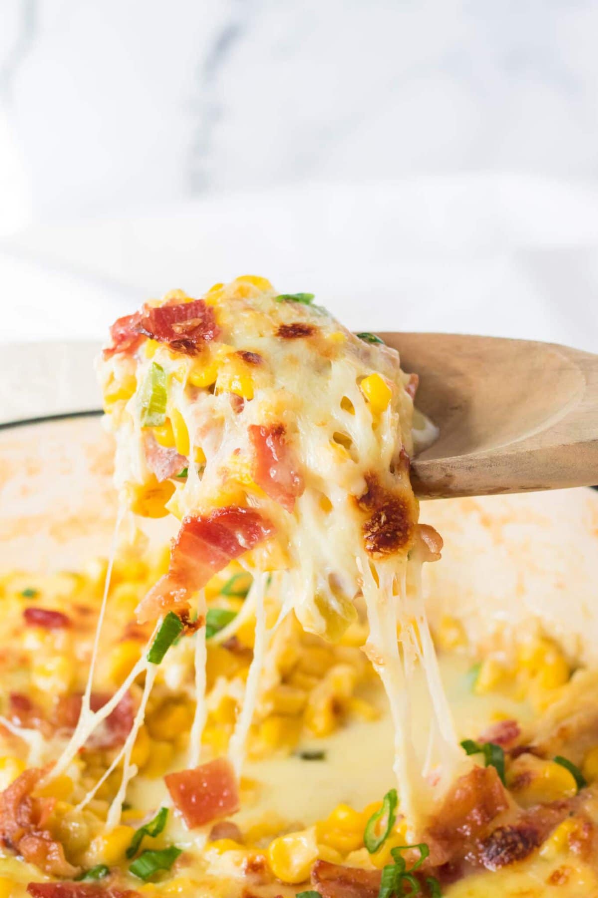 A spoonful of cheesy Corn.