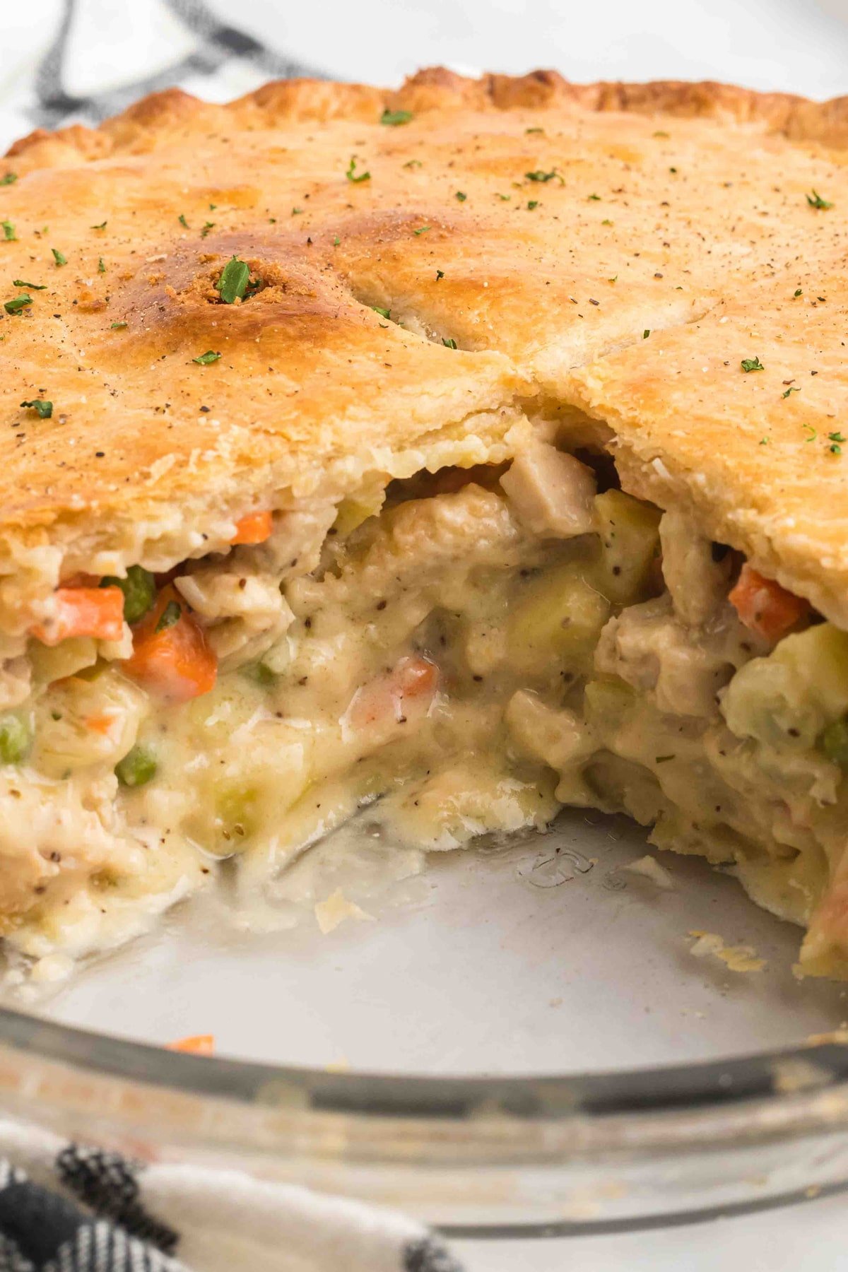Chicken pot pie with a slice missing
