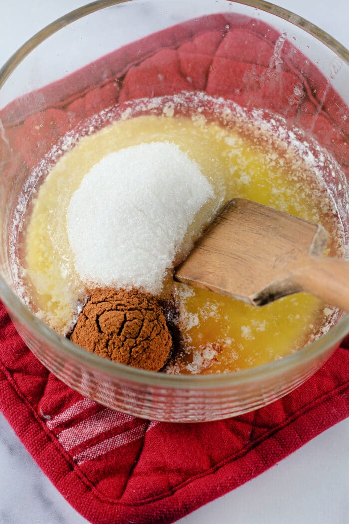 butter, sugar, and cinnamon in a clear bowl.