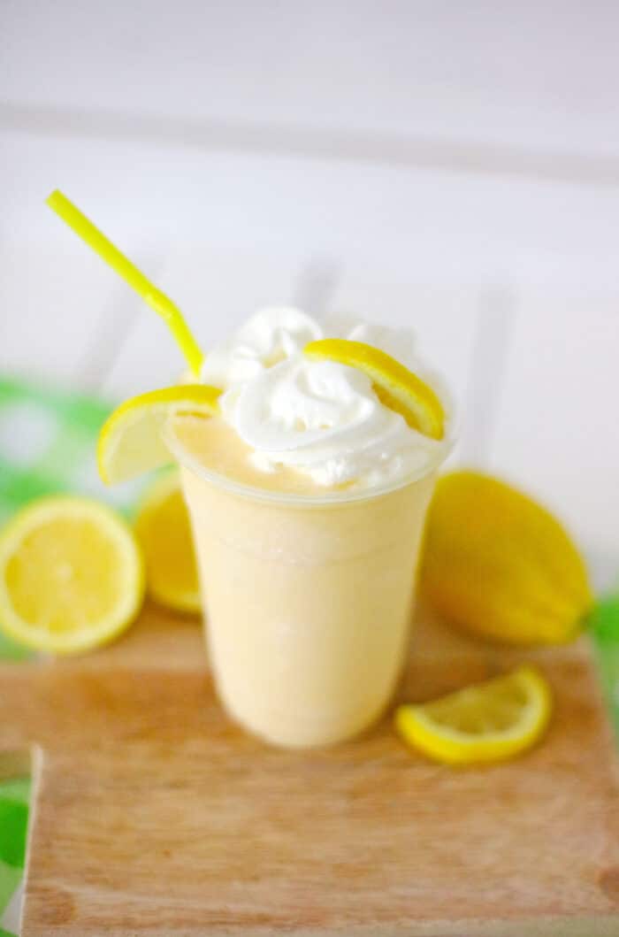 The Copycat Chic Fil A Frosted Lemonade topped with whipped cream.