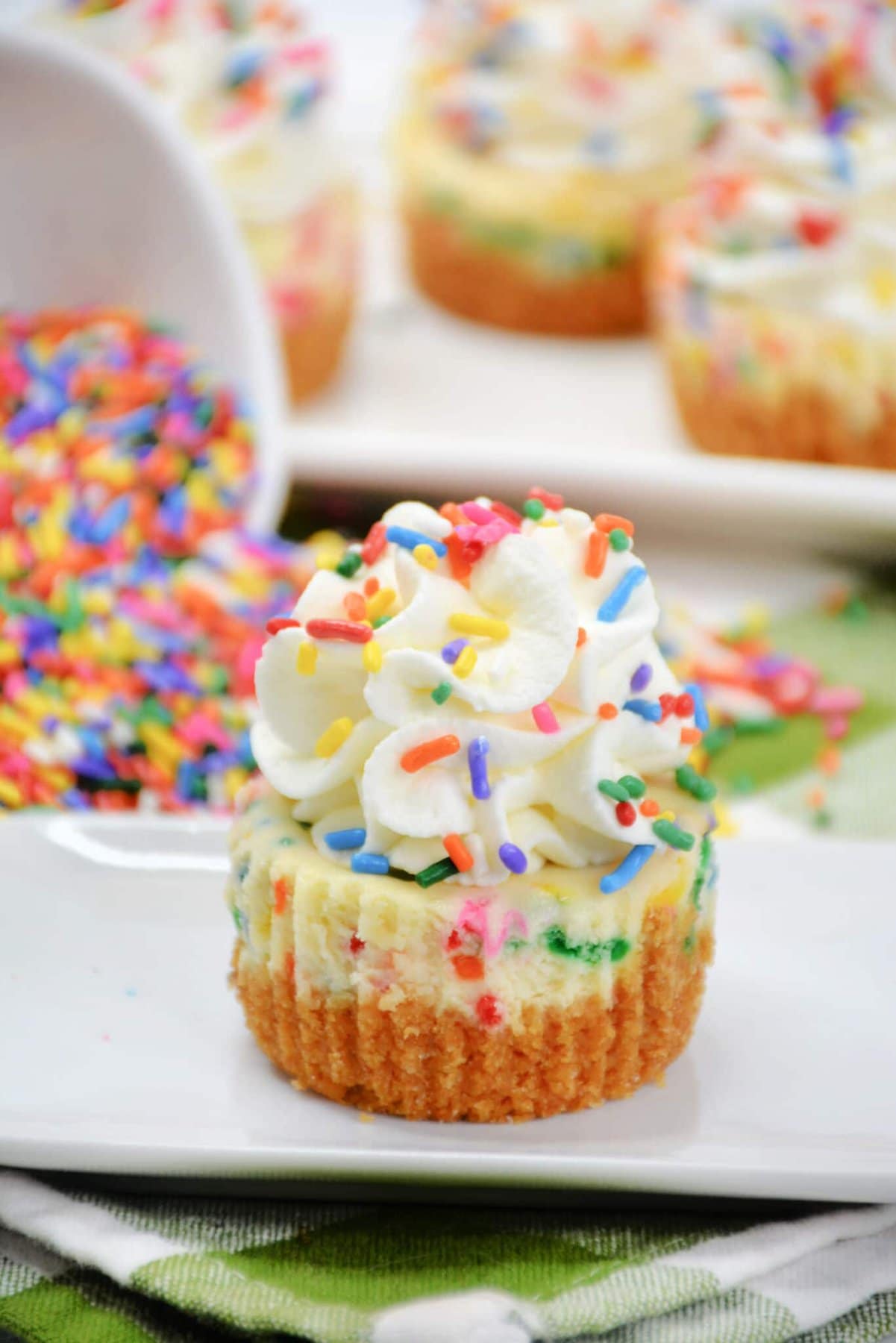 Funfetti Mini Cheesecake topped with sprinkles.