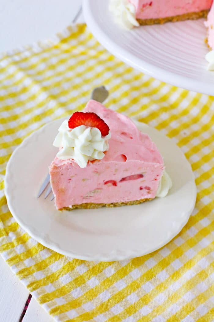 Strawberry Pie Cheesecake on a white plate.