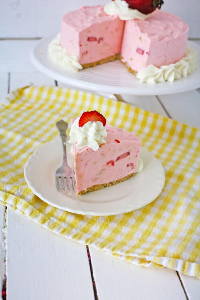 Strawberry Pie Cheesecake on a yellow table cloth.