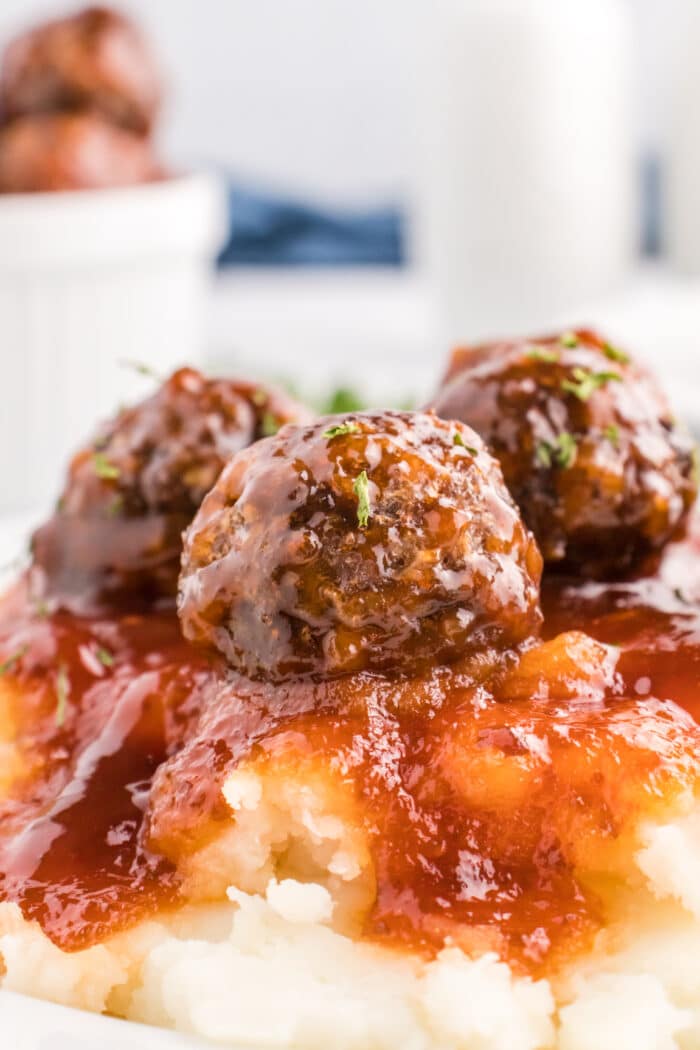The Sweet And Sour Meatballs on top of mashed potatoes.