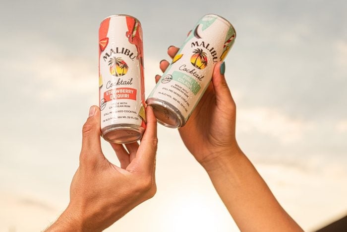 malibu canned cocktails in hands
