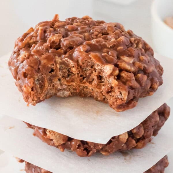 Star Crunch Cookies stacked with parchment paper in between.
