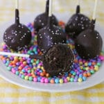Close up of Starbucks Chocolate Cake Pops on a plate with rainbow sprinkles.