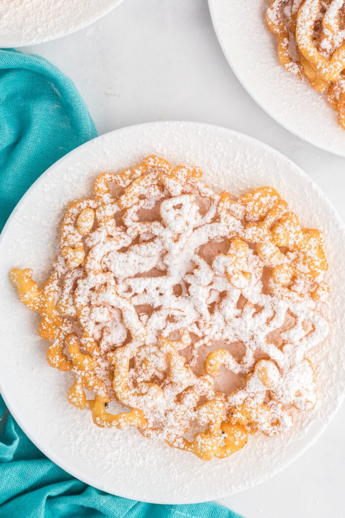 Funnel Cake Recipe on a white plate.