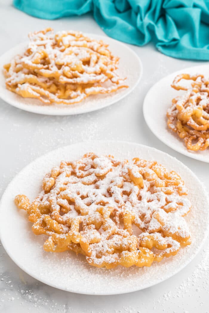 3 Funnel Cake on 3 plates.