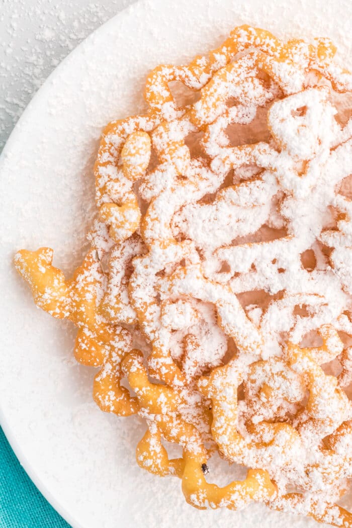 Funnel Cake topped with powdered sugar.