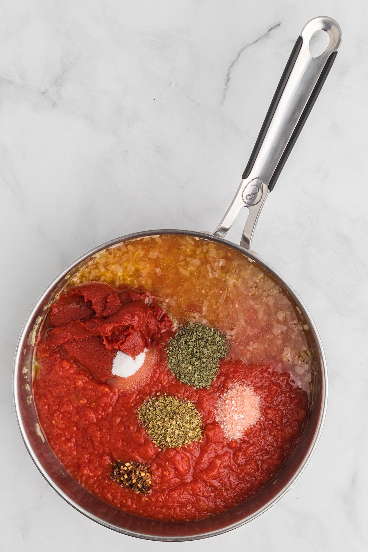 Marinara sauce ingredients in a pan