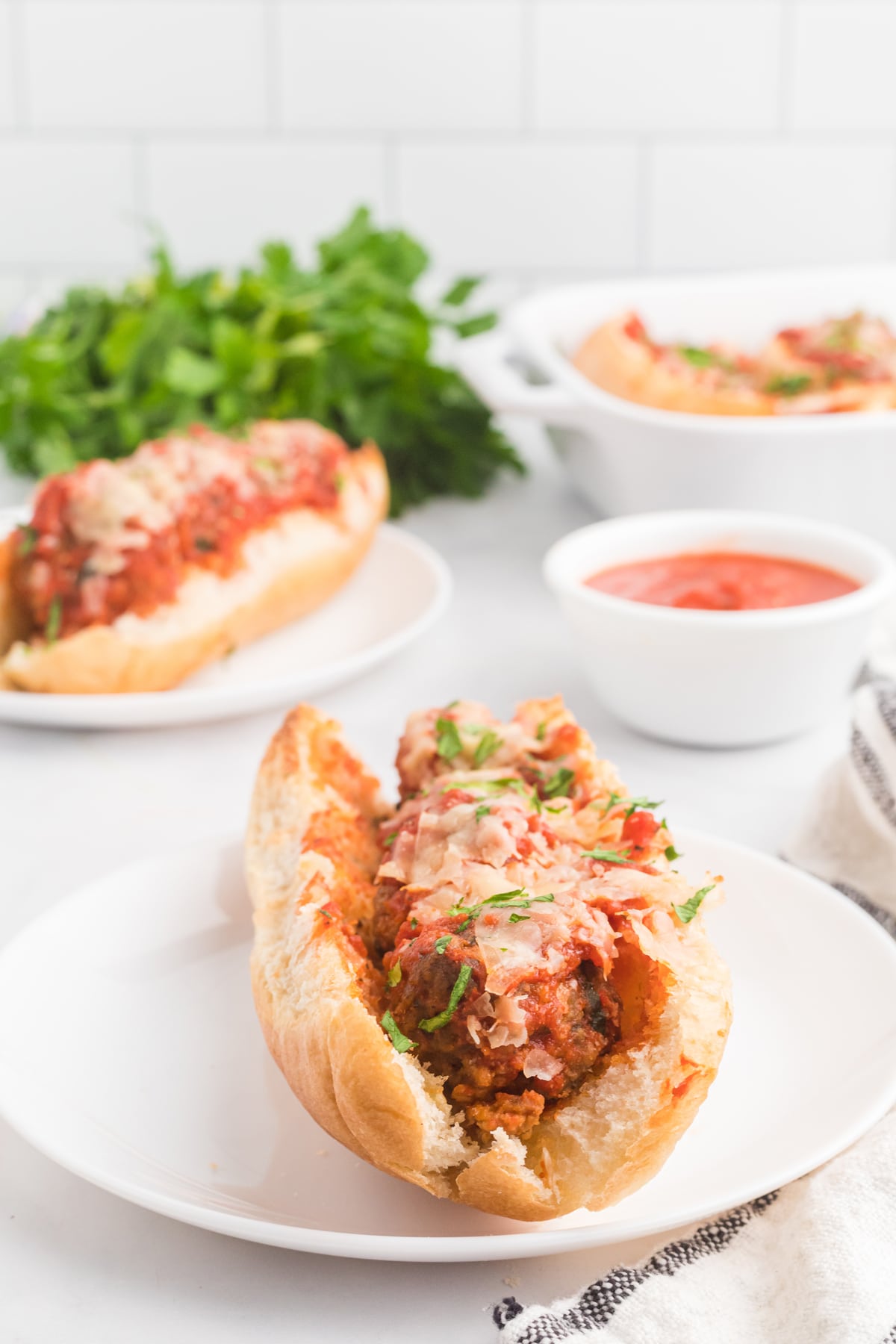 Overhead view of meatball subs on plates