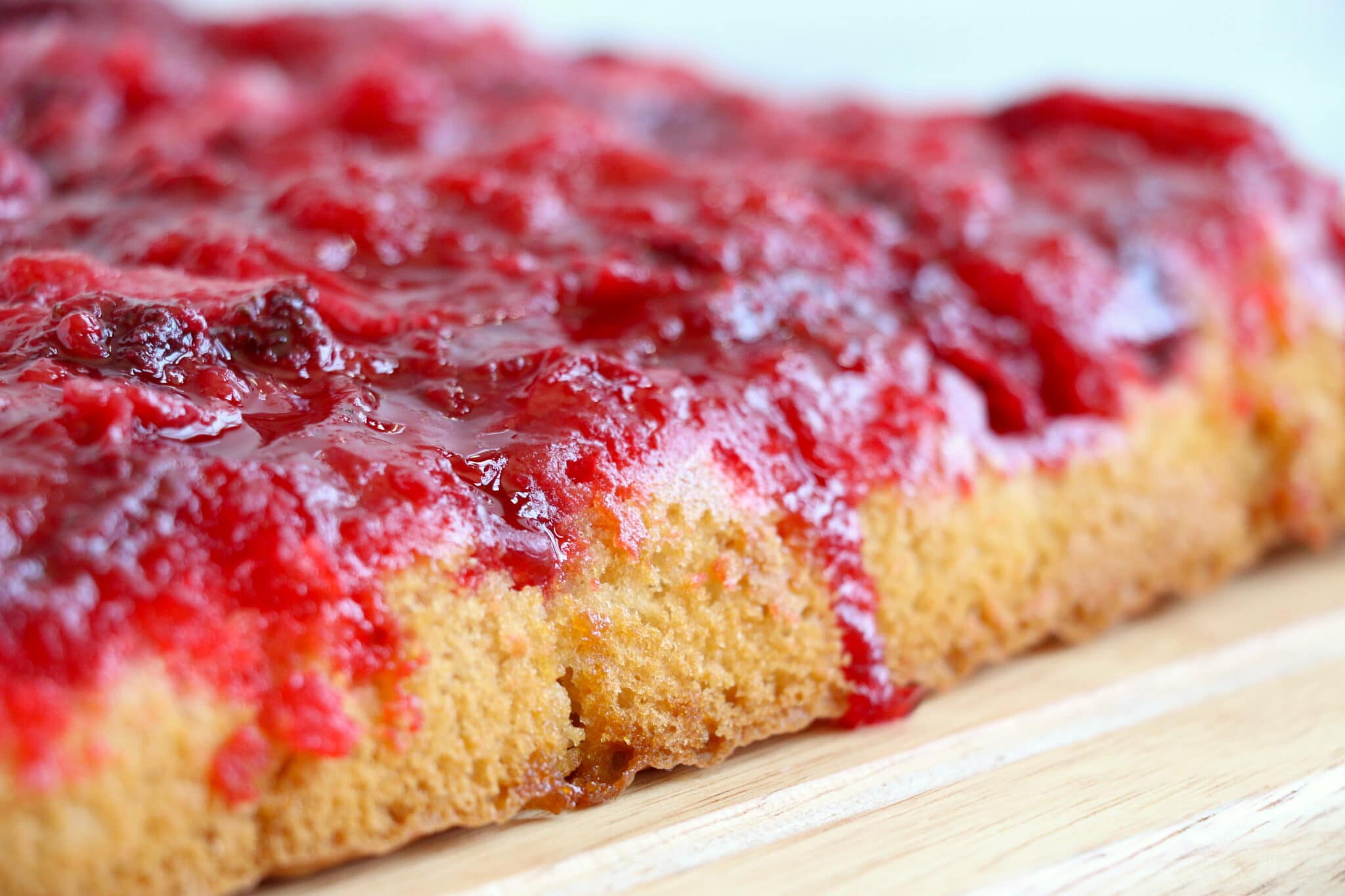 Strawberry Upside Down Cake on a white table.