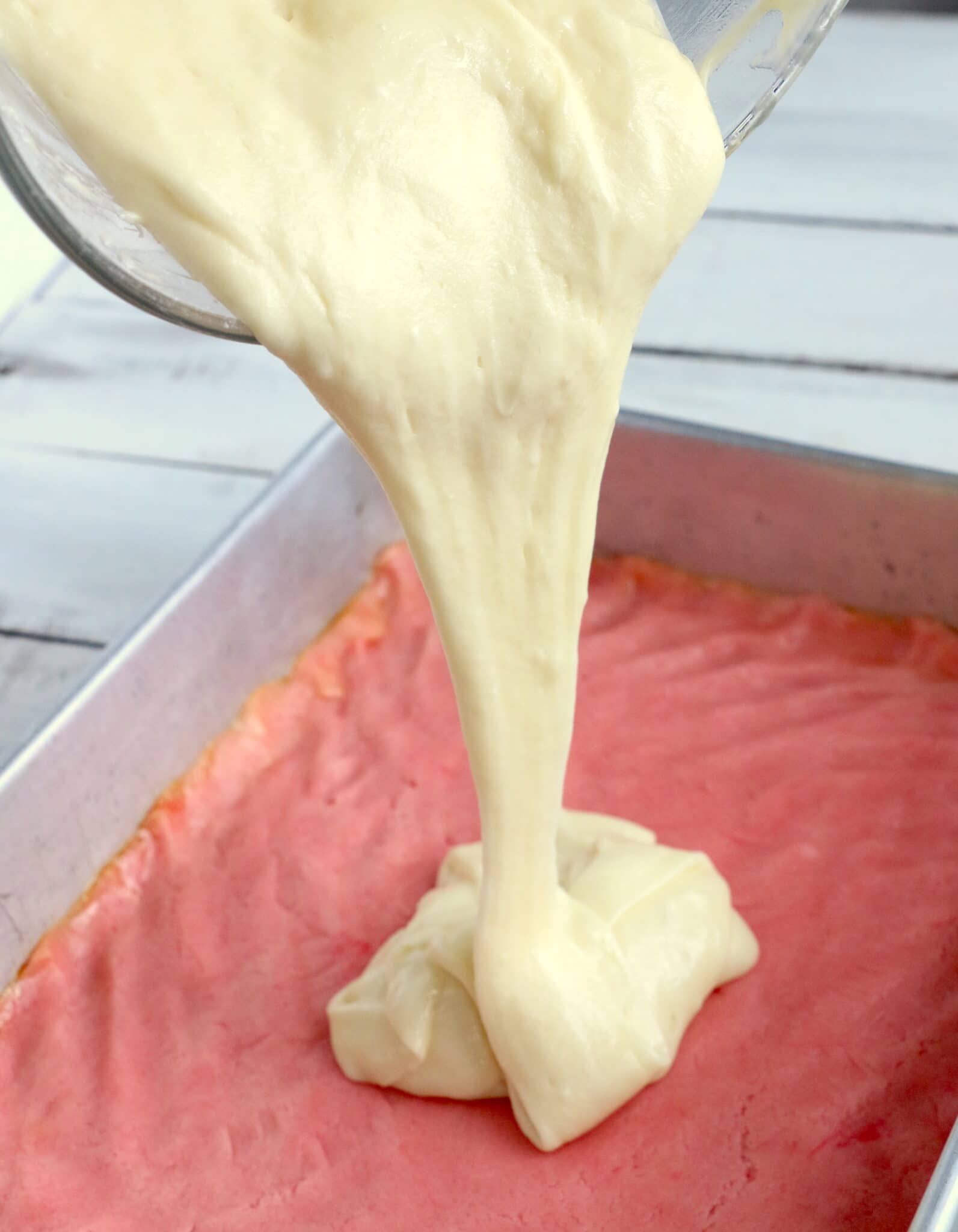 pouring the batter in over the crust