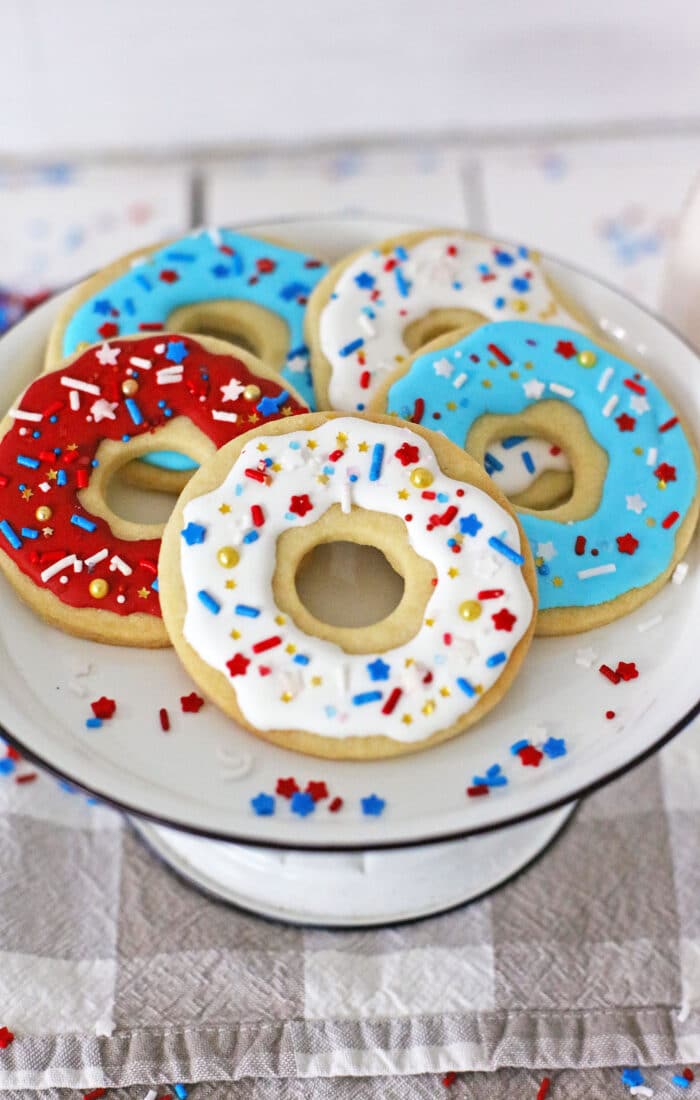 red, white and blue donut cookies on a plate