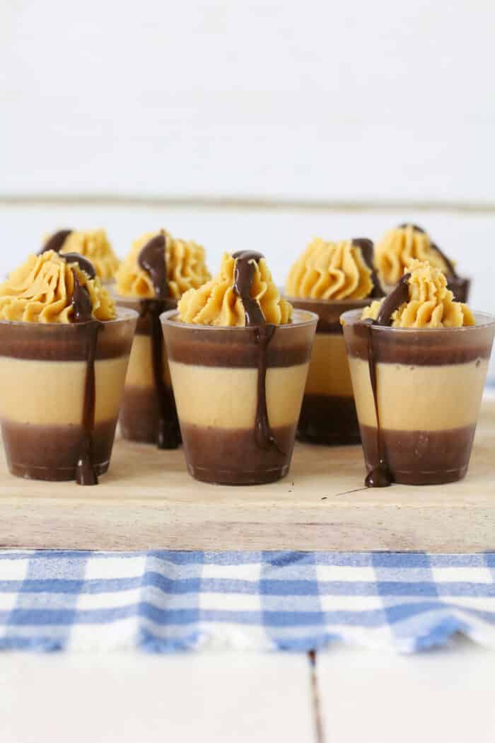 Chocolate Peanut Butter Shots topped with chocolate ganache.