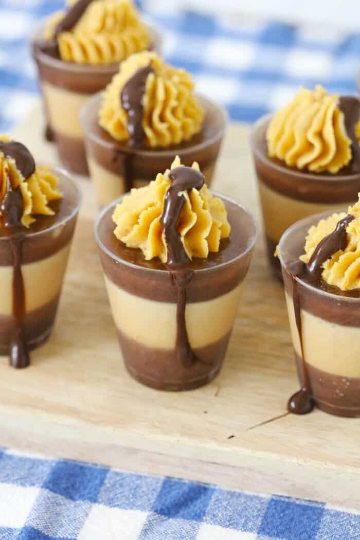 Chocolate Peanut Butter Shots topped with peanut butter frosting.