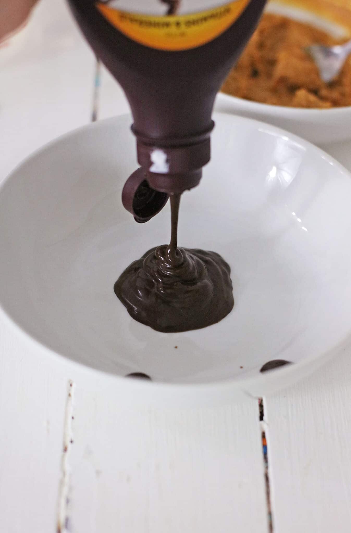 Adding the chocolate syrup.